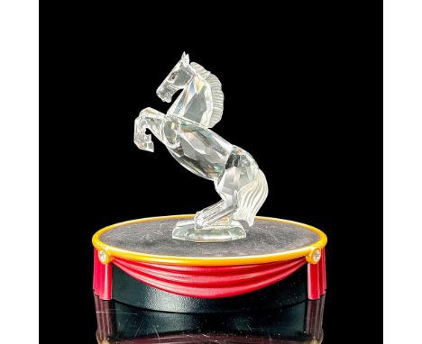 This majestic and powerful animal is represented in brilliant clear crystal with a frosted tail and mane. His dark eye are ma