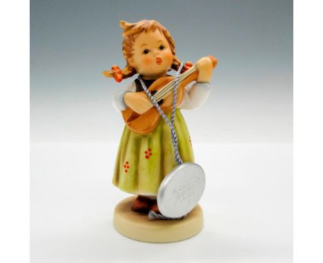 Adorable little girl with guitar. Hummel Goebel tag - Closed Edition. Goebel backstamp. Issued: 2000 - 2008Dimensions: 2"L x 