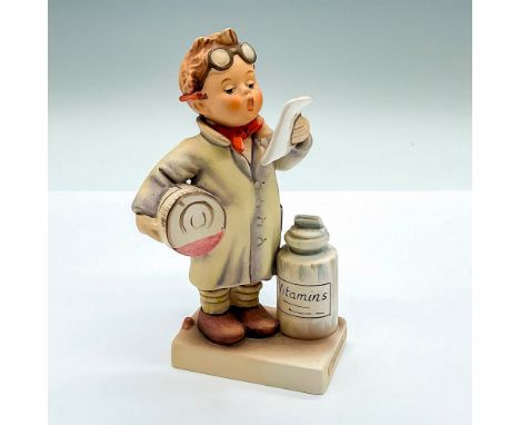 Hand painted figure of a young boy with large medical bottles. Goebel Hummel backstamp. Issued: c. 1979-1990Dimensions: 3.25"