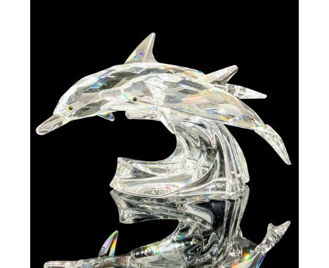 lead crystal part of the SCS Mother and Child trilogy, modeled as the mother and her young swimming on a wave. Swarovski etch