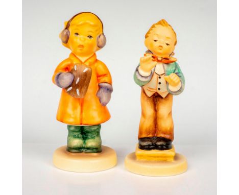Hand painted in matte finish modeled as a girl wearing ear muffs and mittens carrying a treat and a young commander leading t