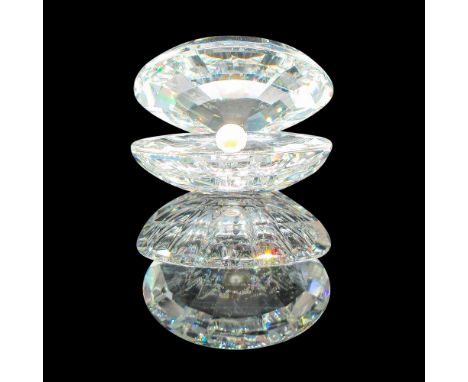 Part of the Aquatic Worlds group. Clear, faceted figural with white crystal in center. Swarovski backstamp. 7624055000. This 