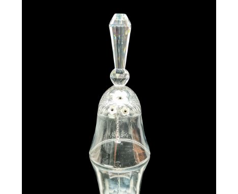 The bell is made from clear crystal and has 3 small, frosted flowers on it, with black centers. This item has its original bo