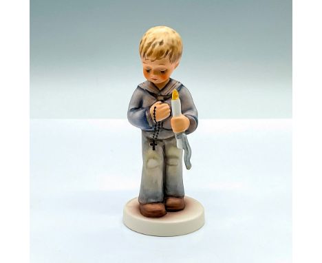 Hand painted figure of a young boy holding a candle and rosary beads. Goebel Hummel backstamp. Issued: c. 1990-1999Dimensions