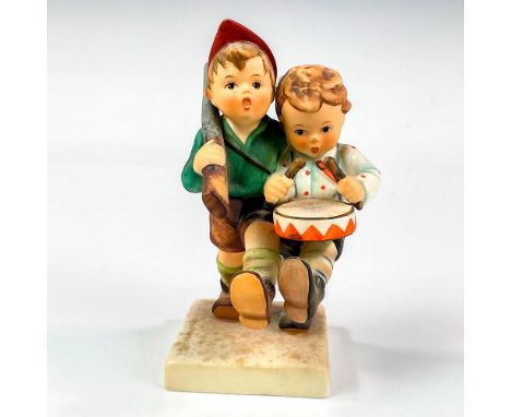 Matte finished figural of boys marching off to help. Hummel impressed mark. Goebel backstamp. Issued: 1979 - 1990Dimensions: 