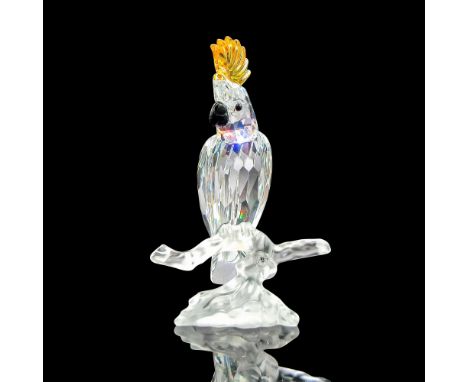 Part of the Feathered Beauties group. Clear faceted body with yellow crest and black beak and eyes perched on frosted crystal