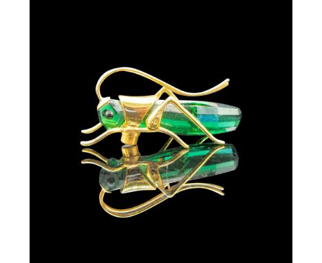 Green crystal figural with button eyes and gold toned metal made into the antennae, legs and body. Swarovski backstamp. Issue