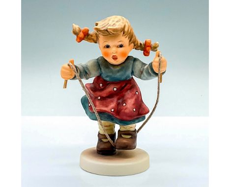 Hand painted figure of a young girl playing with her jump rope. Goebel Hummel backstamp. Issued: 2001Dimensions: 3.5"L x 3"W 
