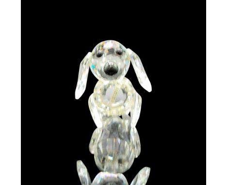 Clear faceted body with black button eyes and nose with floppy metal braided tail. Swarovski backstamp. 7672042000. Artist: M