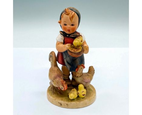 Hand painted figure of a young girl feeling chickens. Goebel Hummel backstamp. Issued: c. 1950-1959Dimensions: 3"L x 2.75"W x