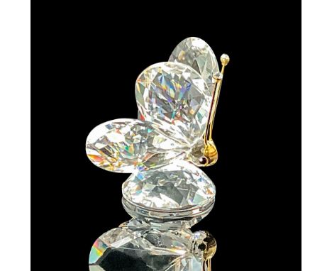 Lead crystal part of the In A Summer Meadow series, made with gold-tone antenna and face. Swarovski etched backstamp. This it