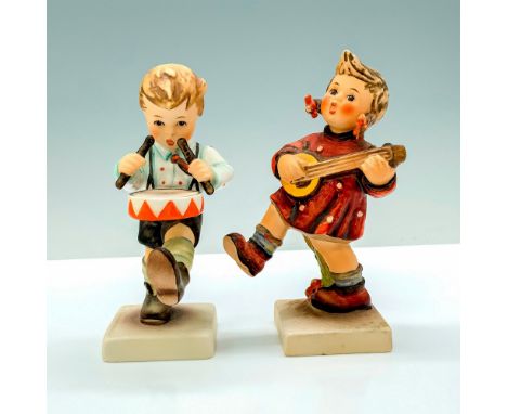 A pair of porcelain figures, Drummer Boy (1990-1999) depicts a young boy playing a marching drum, Happiness Girl (1972-1979) 