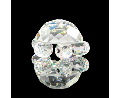 Part of the Endangered Species group. Clear domed, faceted body with round legs, pointed tail and black eyes. Swarovski backs