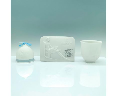 A set of three white porcelain Lladro items consisting of a Don Quixote Plaque, Sailing the Seas Cup, and a 1994 collectors s