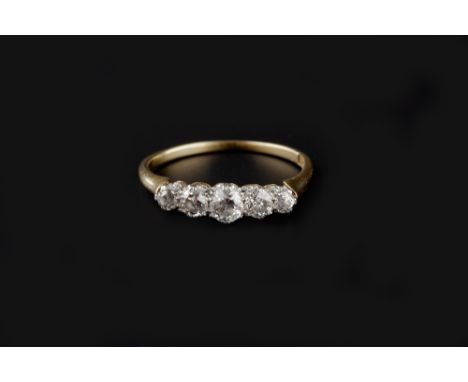 A DIAMOND FIVE STONE RING, the graduated old brilliant and brilliant-cut diamonds in claw setting, to shank stamped '18ct', t