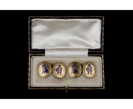 A PAIR OF VICTORIAN ENAMEL CUFFLINKS, comprising oval panels with foliate engraved borders, each decorated with monogram and 