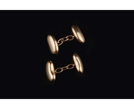 A PAIR OF CUFFLINKS, the panels modelled as kidney beans, with chain-link fittings between, stamped '15', panel length 1.55cm