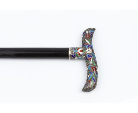 A RUSSIAN SILVER AND ENAMEL HANDLED WALKING CANE, the Tau form handle with stylised floral and foliate champleve enamel decor