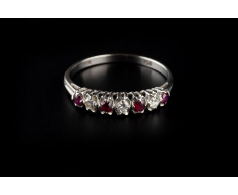 A RUBY AND DIAMOND HALF HOOP RING, alternately set with circular mixed-cut rubies and single-cut diamonds, white precious met
