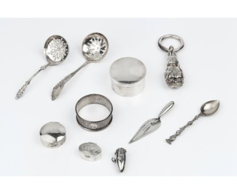 A SILVER BABY'S RATTLE modelled as Peter Rabbit, with teether ring, London 1961; a silver circular box and cover, 4.5cm; two 