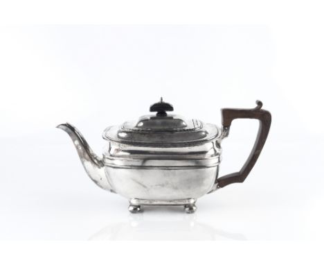 A SILVER TEAPOT of rounded rectangular form, with ebonised handle and knop by George Howson, Sheffield 1929, 14cm high, 23 oz