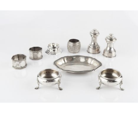 A COLLECTION OF SILVER, comprising a pair of circular salts, on hoof feet by Garrard & Co Ltd, London 1938, a trencher salt, 