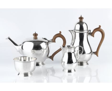 A SILVER FOUR PIECE TEA SERVICE, comprising teapot of bullet shape, baluster hot water pot, milk jug and sugar basin, the tea