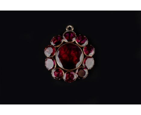 AN AUSTRO-HUNGARIAN ENAMEL AND GEM SET PANEL BROOCH, the openwork scrolled panel centred with a cabochon opal and ruby cluste