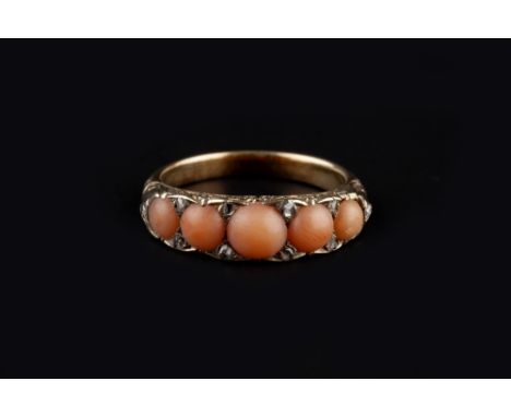A CORAL AND DIAMOND HALF HOOP RING, comprising a line of graduated coral corallium rubrum cabochons, spaced by rose-cut diamo