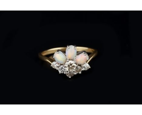 AN OPAL AND DIAMOND DRESS RING, the wishbone-shaped cluster of graduated round brilliant-cut diamonds in claw setting, surmou