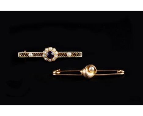 AN AMETHYST AND HALF PEARL CLUSTER BAR BROOCH BY MURRLE BENNETT & CO , the pierced decorated mount with white enamel border, 