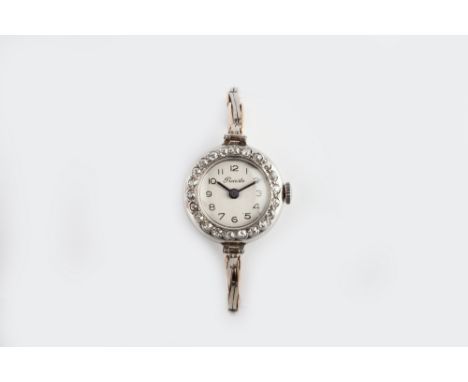 A LADY'S DIAMOND SET BRACELET WATCH, the circular silvered dial with Arabic numerals, signed Precista, to a jewelled manual m