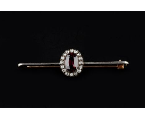 A COLLECTION OF JEWELLERY, comprising a garnet and diamond cluster bar brooch, the oval mixed-cut garnet framed by rose-cut d