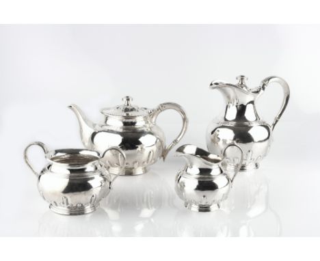 A SCOTTISH SILVER FOUR PIECE TEA SERVICE, with reeded and part lobed bodies, comprising teapot, hot water pot, milk jug and s