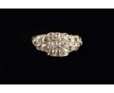 A DIAMOND PANEL RING, the central square panel with a cluster of cushion-shaped old-cut diamonds, between tapered shoulders o