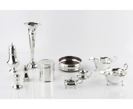 A COLLECTION OF SILVER ITEMS TO INCLUDE: a bottle coaster, London 1985, two sauce boats, a baluster sugar castor, Sheffield 1