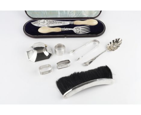 A PAIR OF LATE VICTORIAN SILVER FISH SERVERS, with pierced and engraved decoration and ivory handles by Charles Belk & E Park