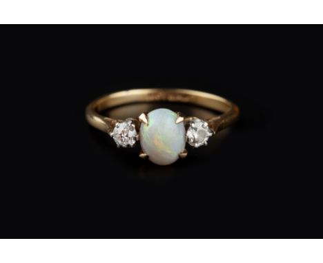 AN OPAL AND DIAMOND THREE STONE RING, the oval cabochon opal claw set between two old-cut diamonds, two colour precious metal