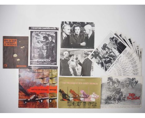 A selection of mixed war film related memorabilia items comprising FIREFOX campaign book; BATTLE OF BRITAIN (x 2); THE CHARGE