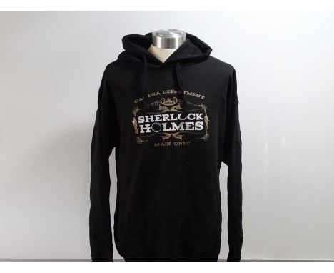 A group of 3 production crew clothing items for SHERLOCK HOLMES comprising a black stunt crew, short sleeved 'M' t-shirt and 