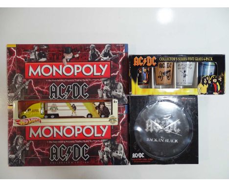 AC/DC - Collection of merchandise to include Monopoly Set x 2; Hot Wheels Truck; Set of 4 Drinking Glasses and Clock (5)