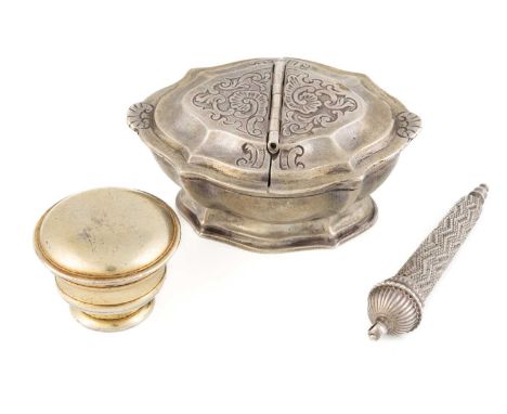 An 18th century silver double spice box, probably German, circa 1740, lobed oval form, the two hinged covers with chased foli