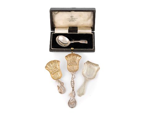 A Victorian silver caddy spoon and sugar spoon, possibly by Hilliard and Thomason, Birmingham 1852,  gilded shovel bowls with