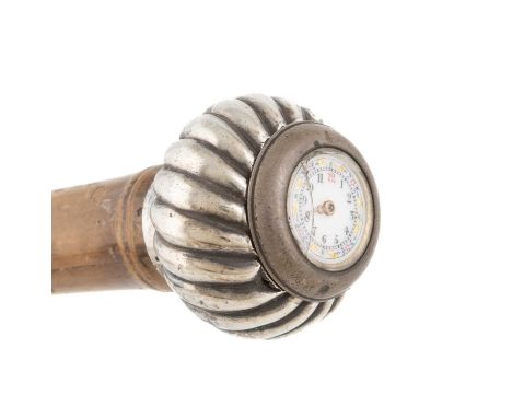 An Austrian silver-mounted watch walking cane,bamboo shaft, the fluted ball handle set with a watch under glass, enamelled fa