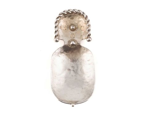 By Michael Allen Bolton, a modern silver caddy spoon,London 1997, oblong form with spot-hammered decoration, rope-work border