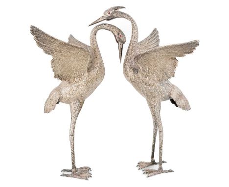 A pair of modern Spanish silver herons,no apparent town or maker's mark,modelled as a male and female pair in standing positi