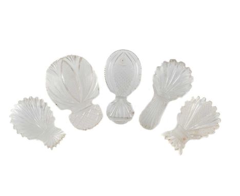 A collection of five 19th century glass caddy spoons, including one with a fish to the bowl, one with three feathers, and thr