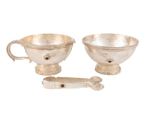 By Michael Allen Bolton, a modern silver cream jug and sugar bowl with a pair of sugar tongs,London 1998, tapering circular f
