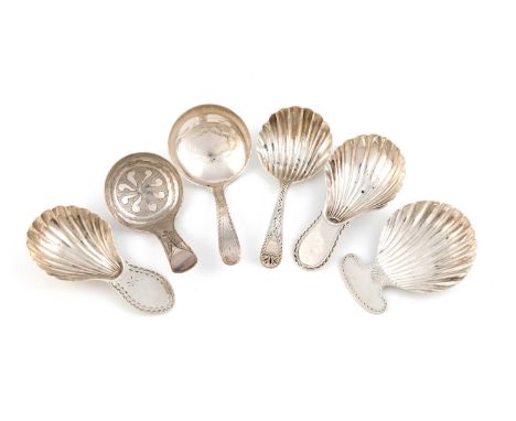 A collection of six antique silver caddy spoons, including: a George III one by Joseph Willmore, Birmingham 1817, the circula
