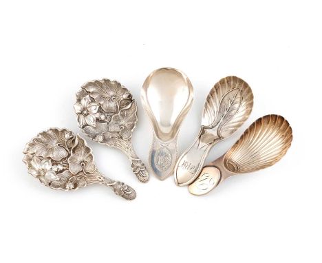 A collection of five antique silver Sheffield made caddy spoons, including: a Victorian pair, by Aaron Hadfield, 1850, the bo